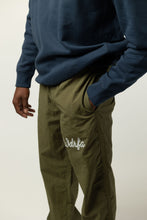 Load image into Gallery viewer, CHAINSTITCH SCRIPT NYLON PANT - OLIVE