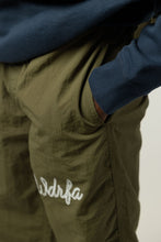 Load image into Gallery viewer, CHAINSTITCH SCRIPT NYLON PANT - OLIVE