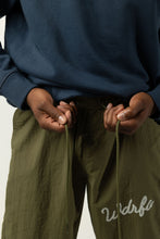 Load image into Gallery viewer, CHAINSTITCH SCRIPT NYLON PANT - OLIVE