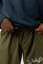 Load image into Gallery viewer, CHAINSTITCH SCRIPT NYLON PANT - OLIVE